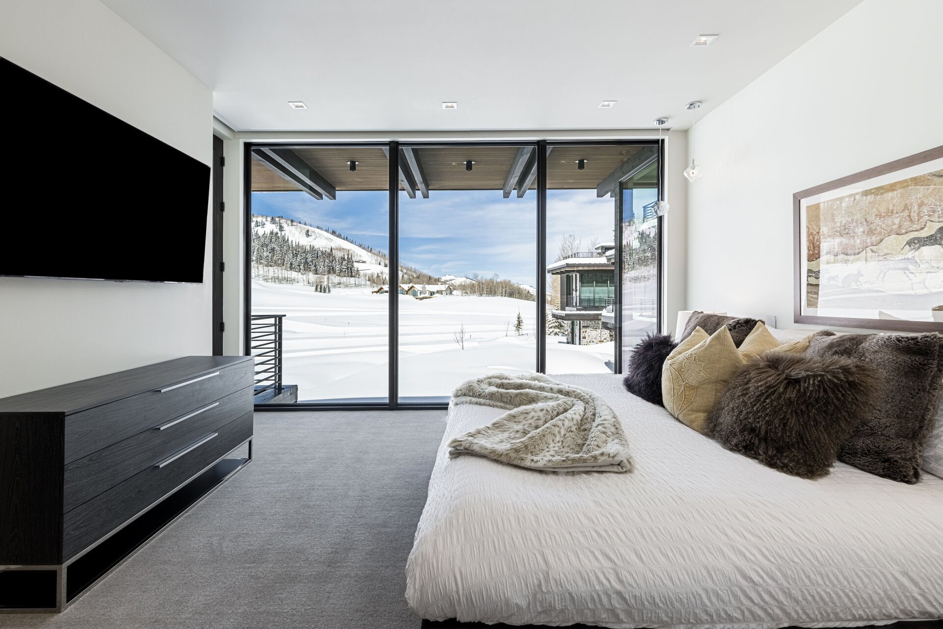 Main level master suite 4 with a king bed, Smart TV and views