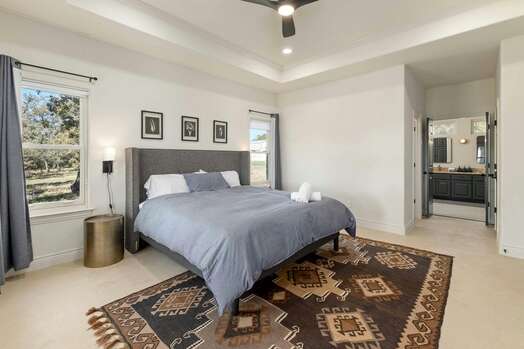 Master Bedroom with King Bed, Access to Backyard and En Suite Bathroom