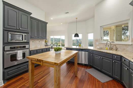 Spacious Kitchen Area with Stainless Steel Appliances