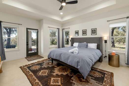 Master Bedroom with King Bed, Access to Backyard and En Suite Bathroom