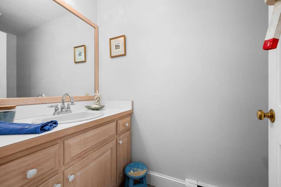 Convenient half bathroom (#2) acting as a deconstructed mudroom as you enter through the back door near the outdoor shower - 853 Route 28 Harwich Port Cape Cod - Sandy Spot