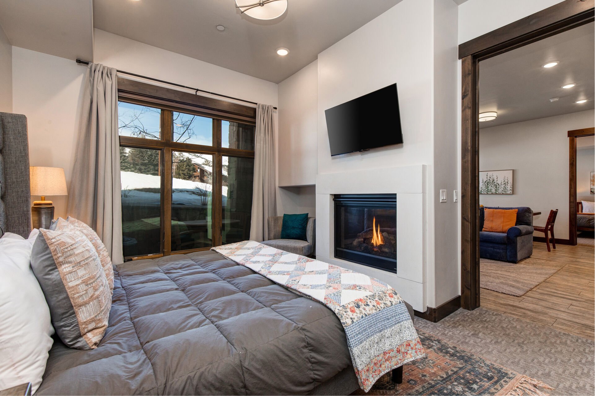 Master bedroom with king bed, ensuite bathroom and mountain views
