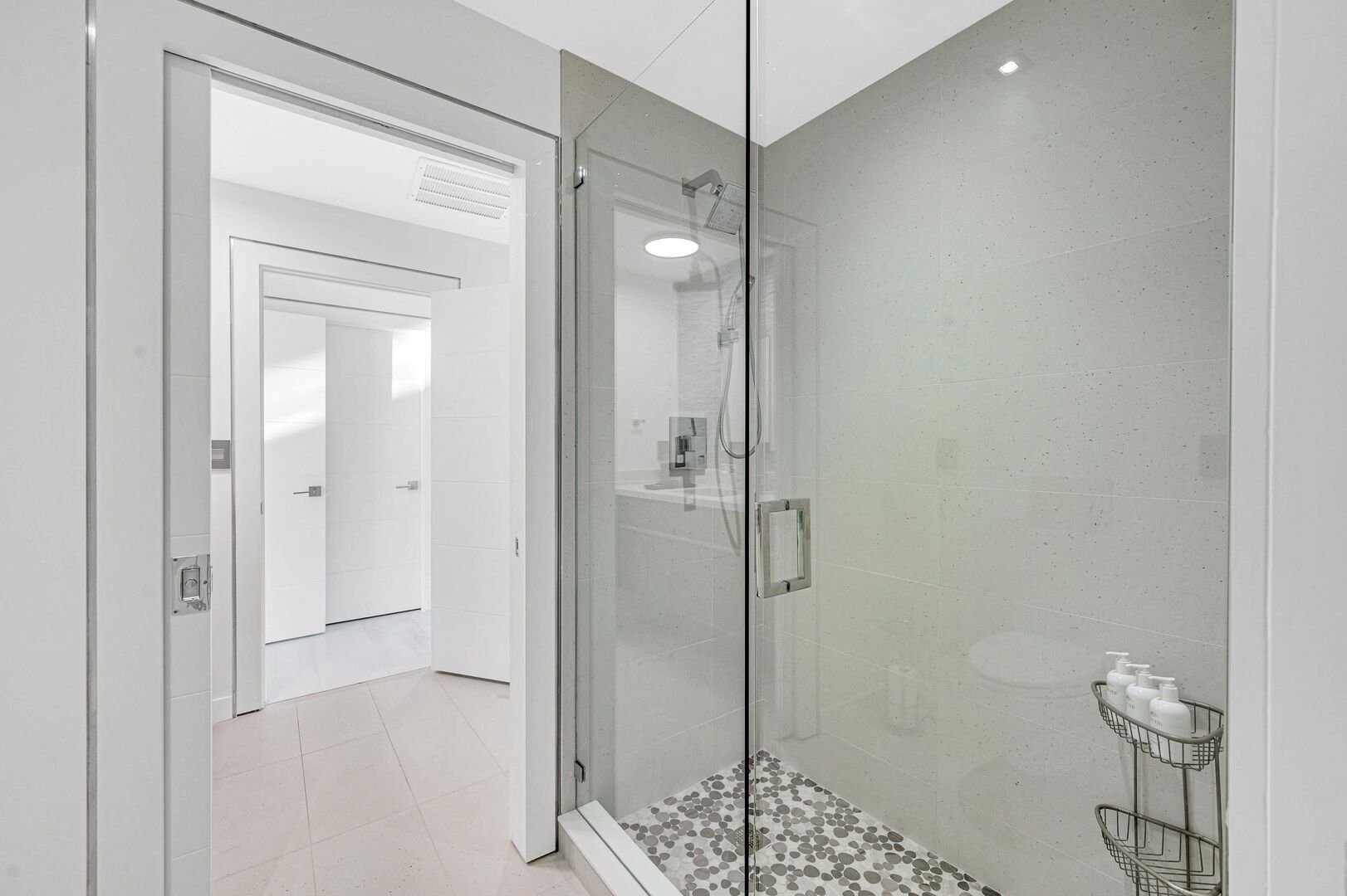 Bedroom two and three share a walk-in shower located between their respective en suite bathrooms.