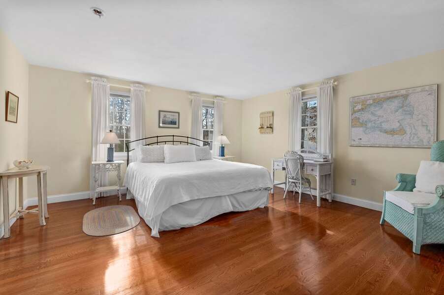 Ample room to spread out in this secondary primary suite (Bedroom #1) located on the main level and offering a King sized bed - 92 Hoyt Road Harwich Port Cape Cod - Apricari - NEVR