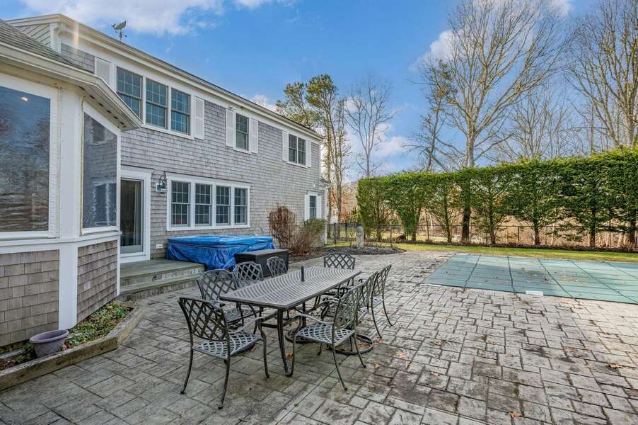 View of outdoor dining set on the patio near the sunroom, hot tub and pool (new photos to come in the Spring when pool is open and plantings are in bloom!) - 92 Hoyt Road Harwich Port Cape Cod - Apricari - NEVR