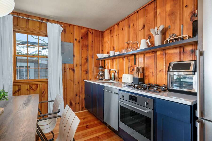 Open shelving and stainless steel appliances provide what you need for meal preparation - 4 Manning Road Dennis Port Cape Cod - Blue Sky
