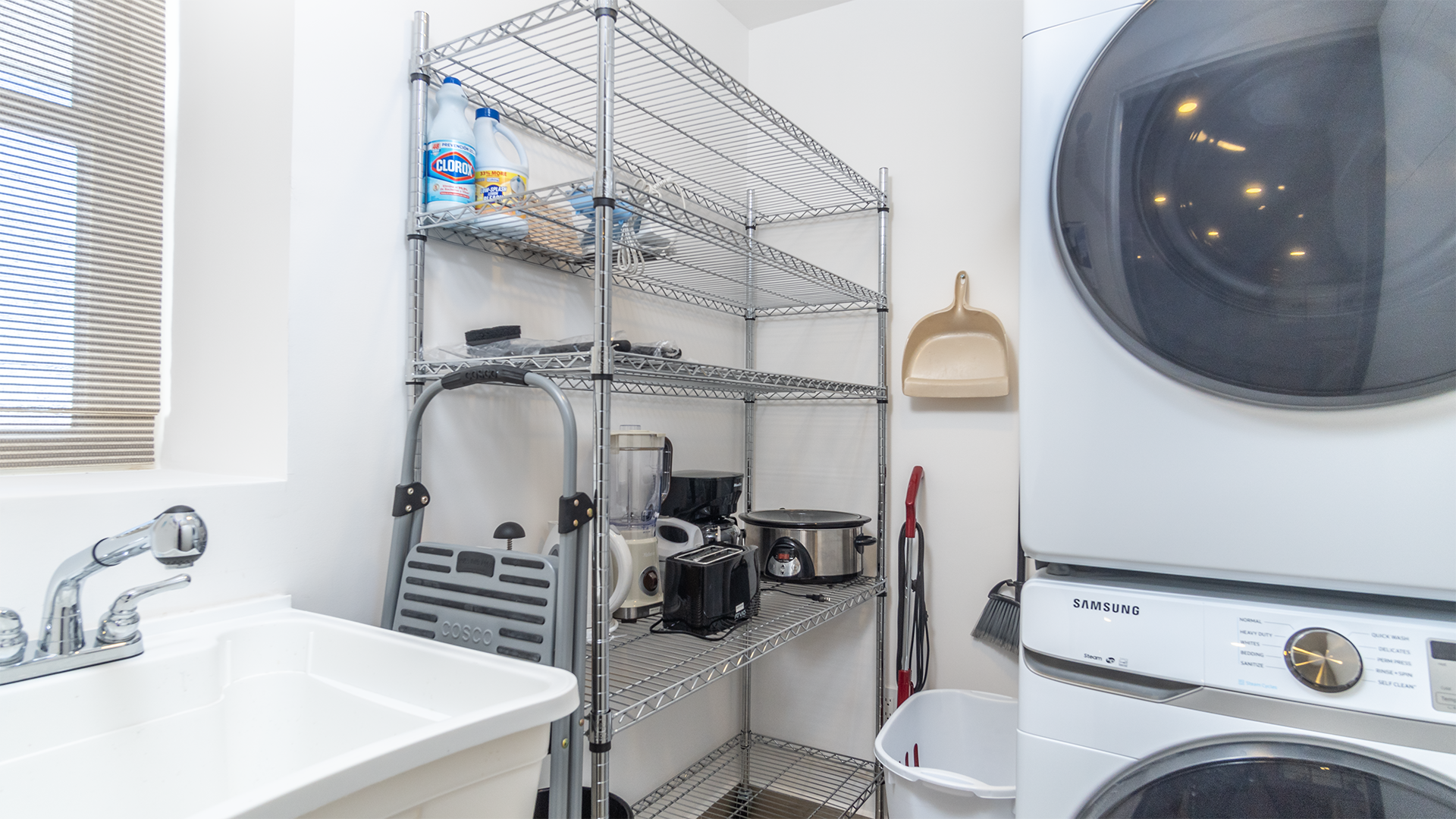washer dryer and sink in the utility room