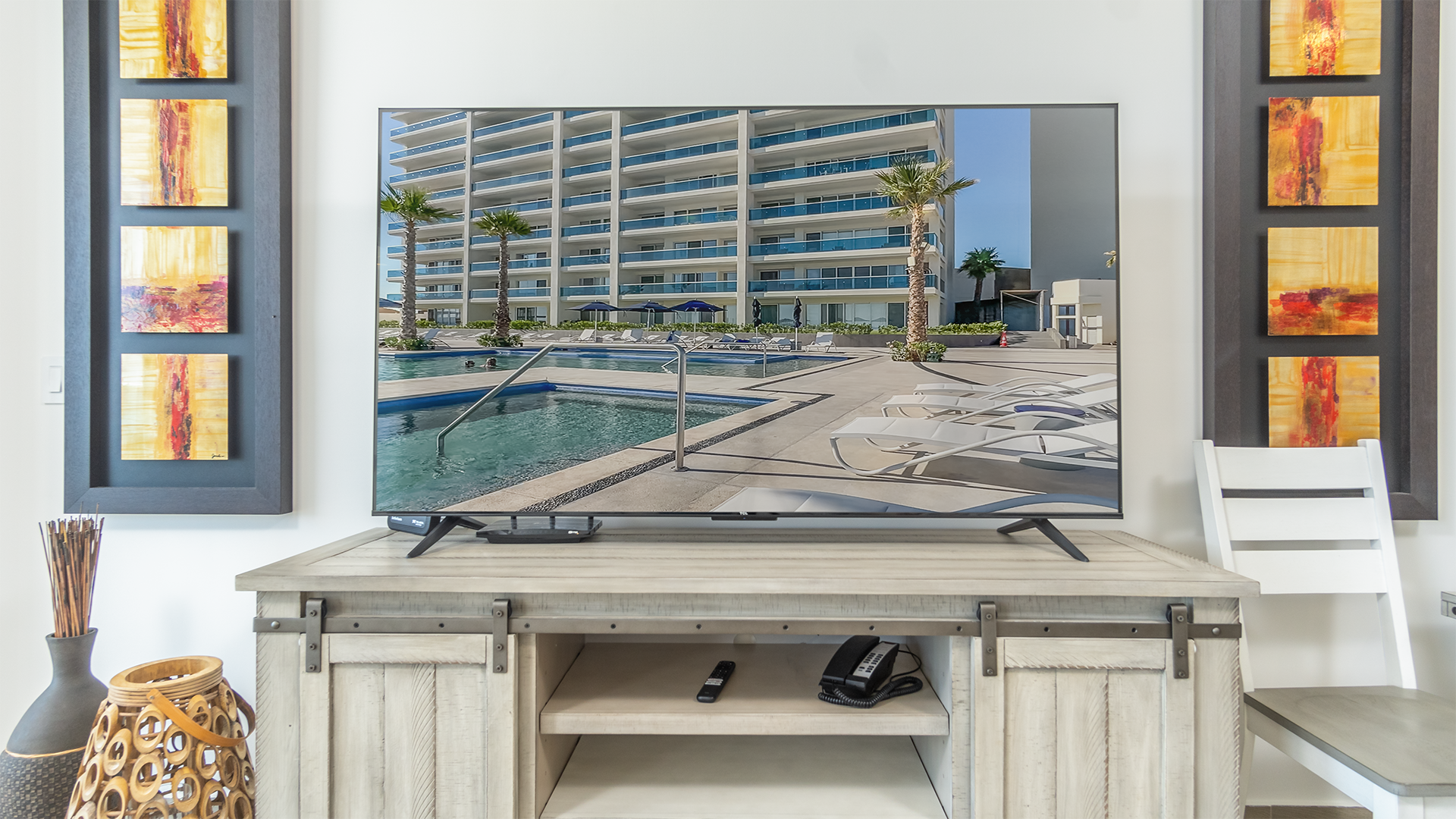 Large TV atop the entertainment center