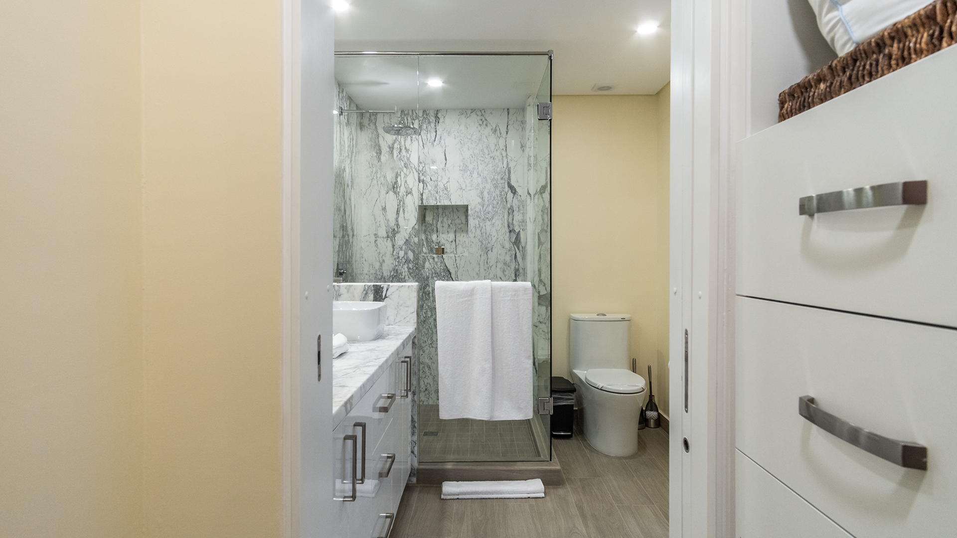 a walk through closet is found between the bedroom and bathroom
