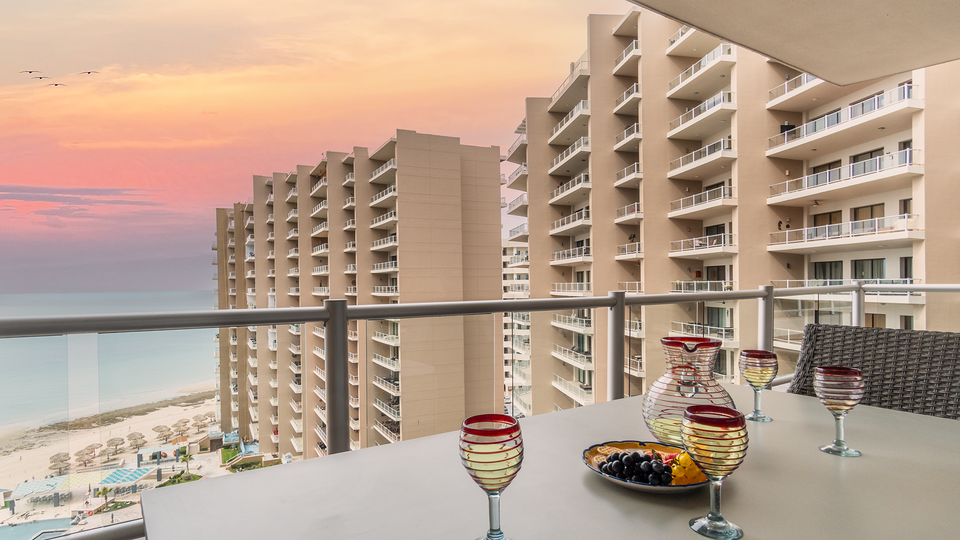 Sunsets are all yours on the sleek balcony.
