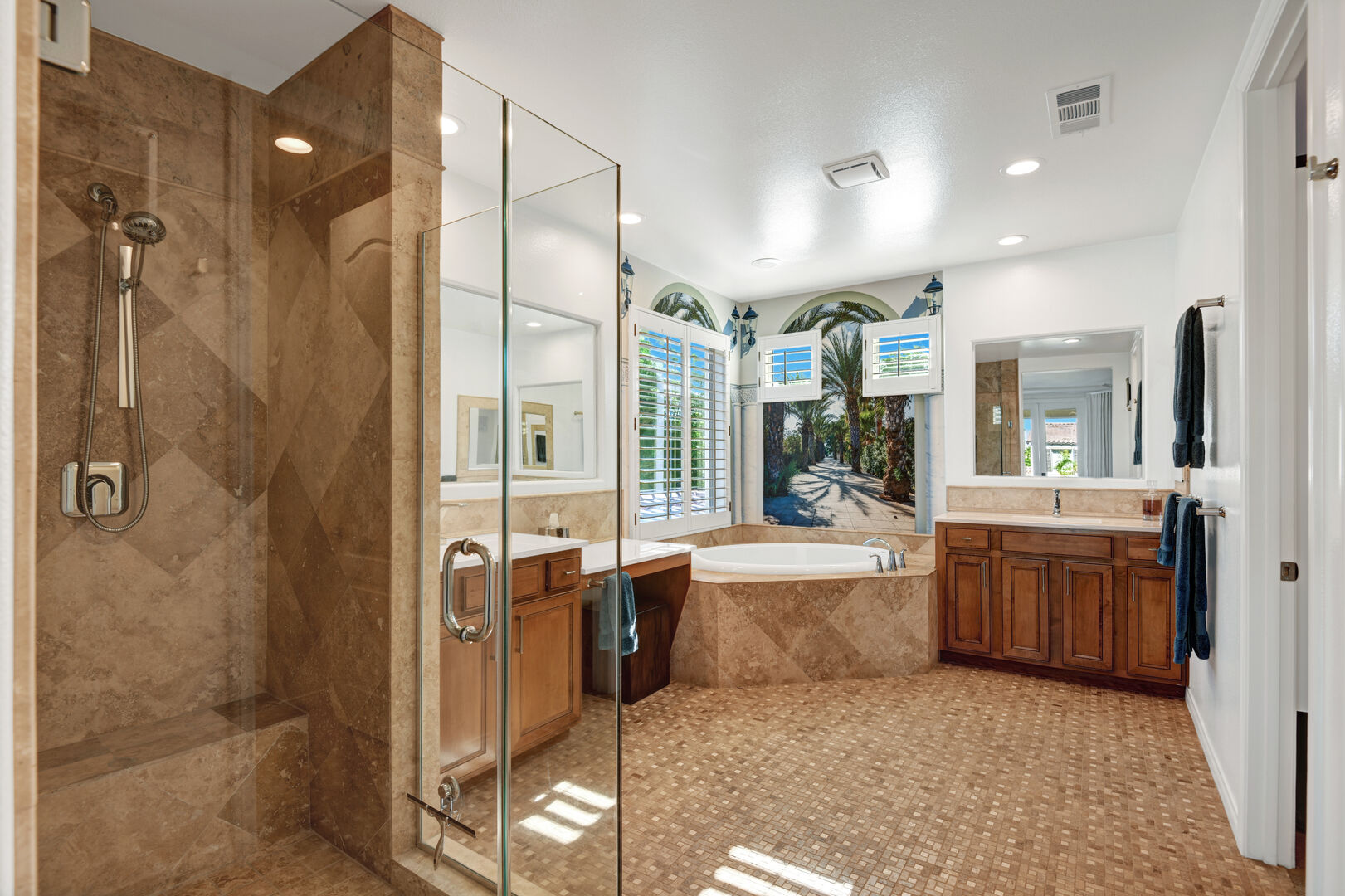 Master Suite 1 bathroom boasts his and her vanity sinks, a relaxing soaking tub, and a tiled shower.