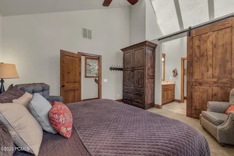3rd level Master bedroom with a king bed and en suite with a barn door