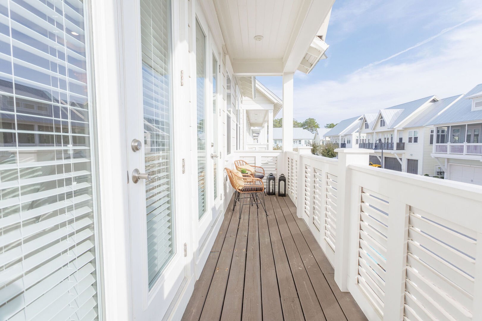 Large balcony spans across the front of the home- perfect for catching sunrise or sunset!