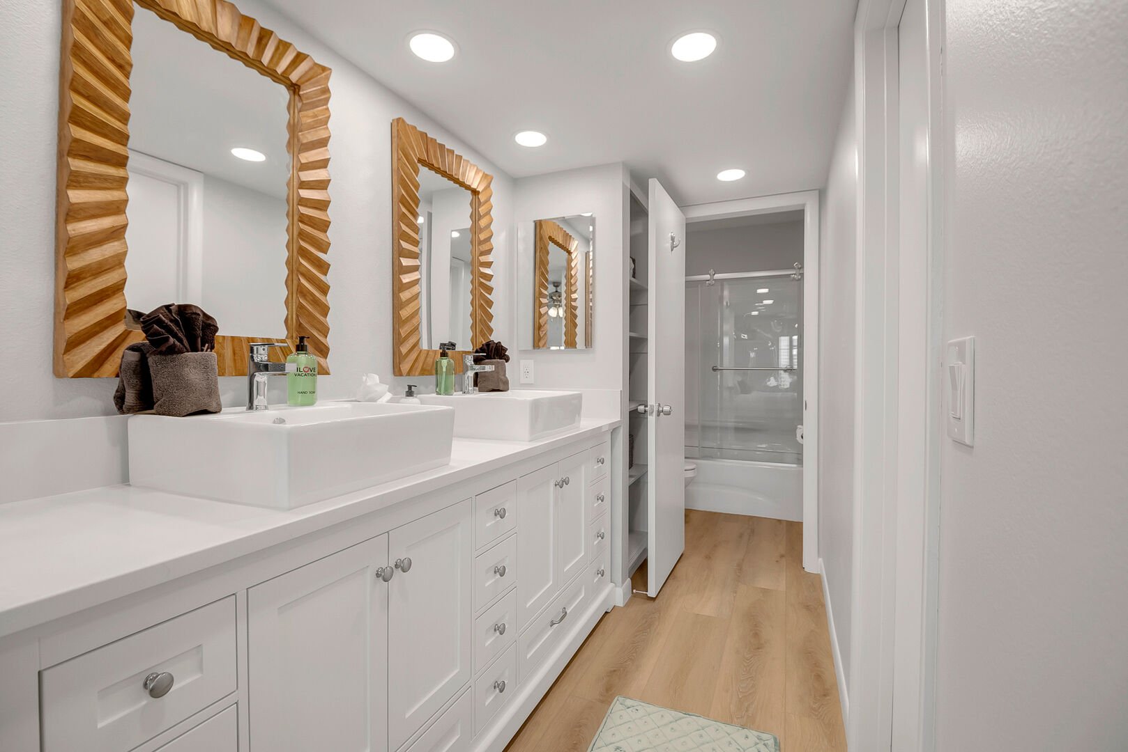 Master bathroom with dual vanity and tub/shower combo