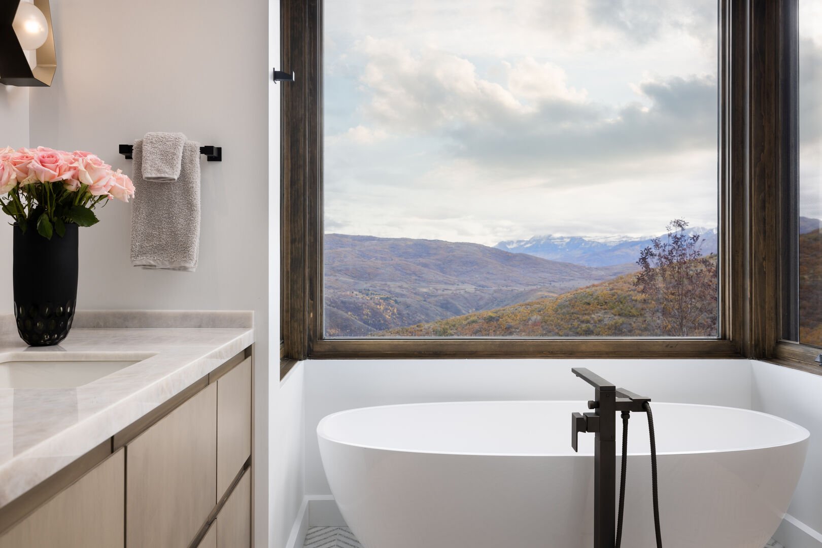 Large soaking tub with mountain views.