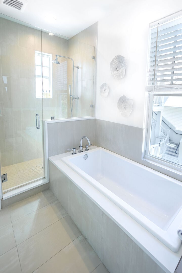 First floor of the carriage house features a full bath with tub and walk-in shower.