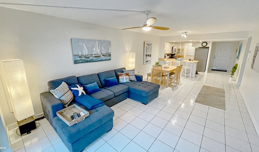 Unwind in a cozy living space that flows seamlessly into the dining area