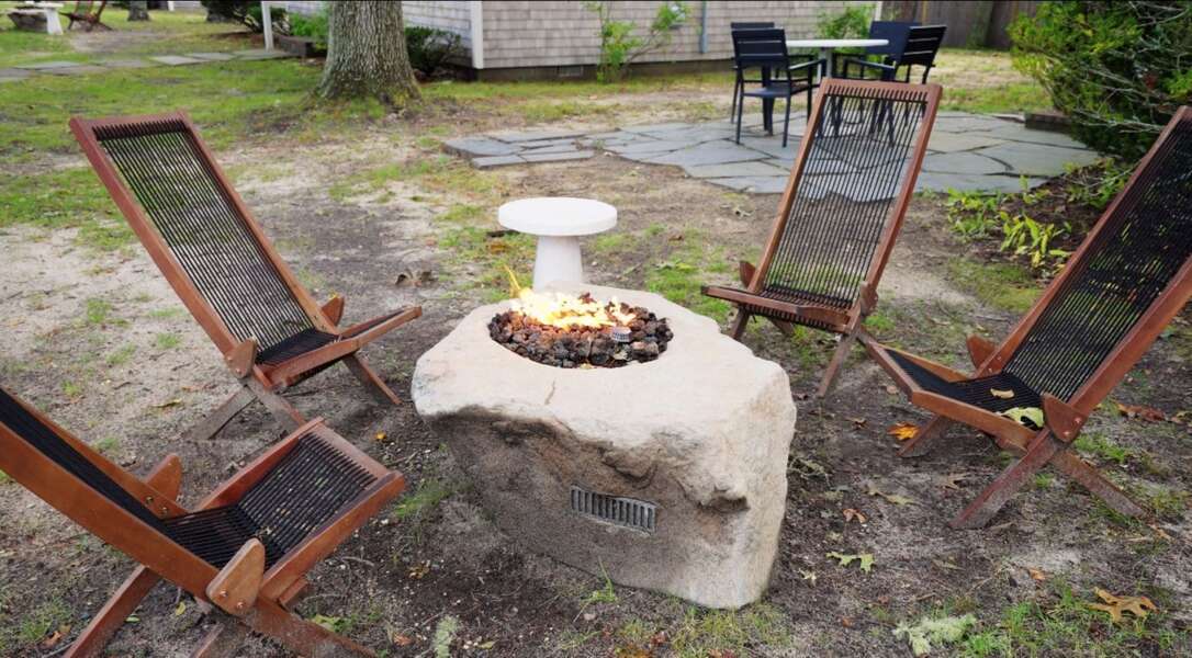 The gas fire pit and seating for 4 people in the front yard, looking towards side yard patio area - 14 Manning Road Dennis Port Cape Cod - Sea