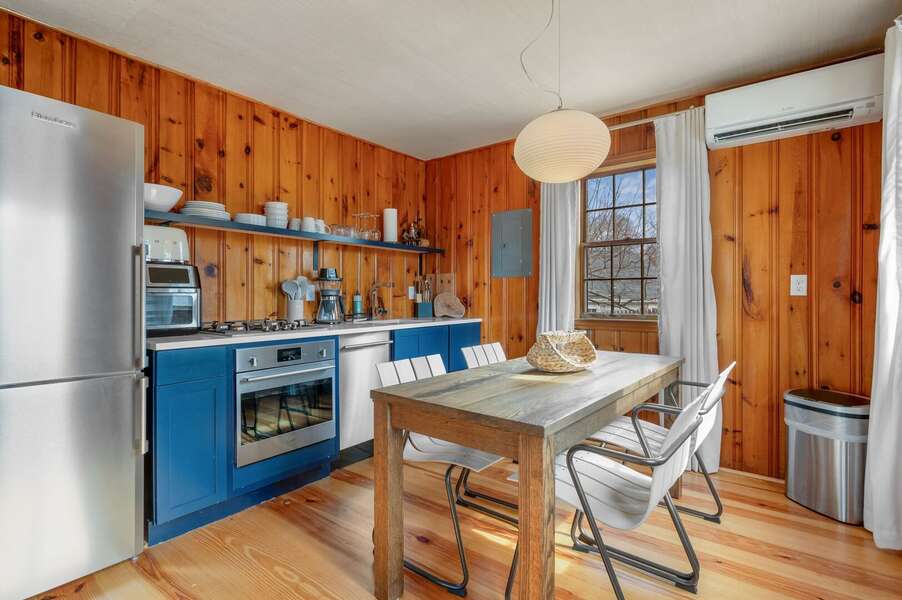An angled view into the kitchen from outside the dining area - 18 Manning Road Dennis Port Cape Cod - Salt