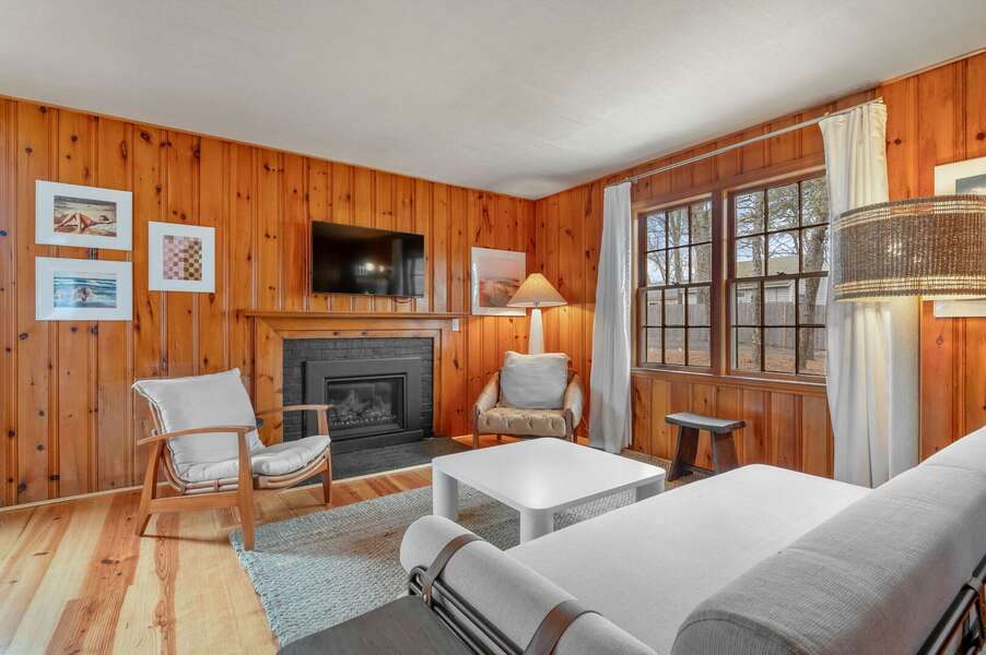The living Room featuring a fireplace, wall-mounted TV and soothing decor- 18 Manning Road Dennis Port Cape Cod - Salt