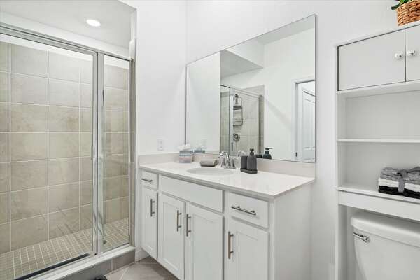 The ensuite bathroom has a walk-in shower
