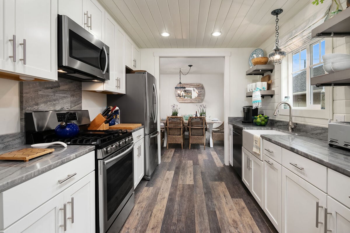 The large, modern kitchen has all of the appliances needed to rustle up family feasts during your beach vacation.