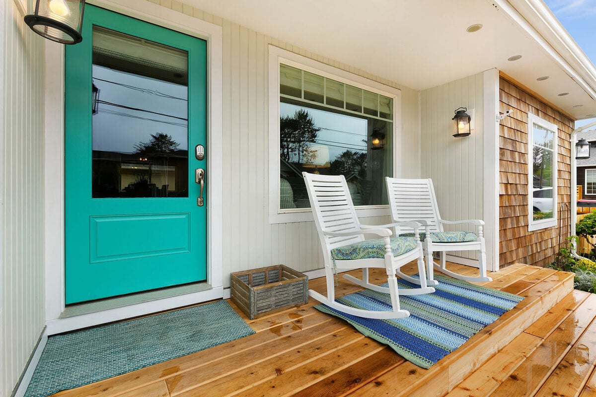 covered front porch with rocking chairs.