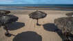 Palapas on the beach.
