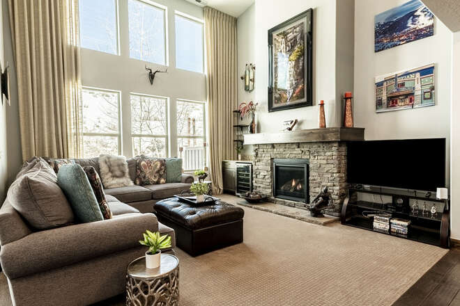 Living room with comfortable seating, gas fireplace and Smart TV