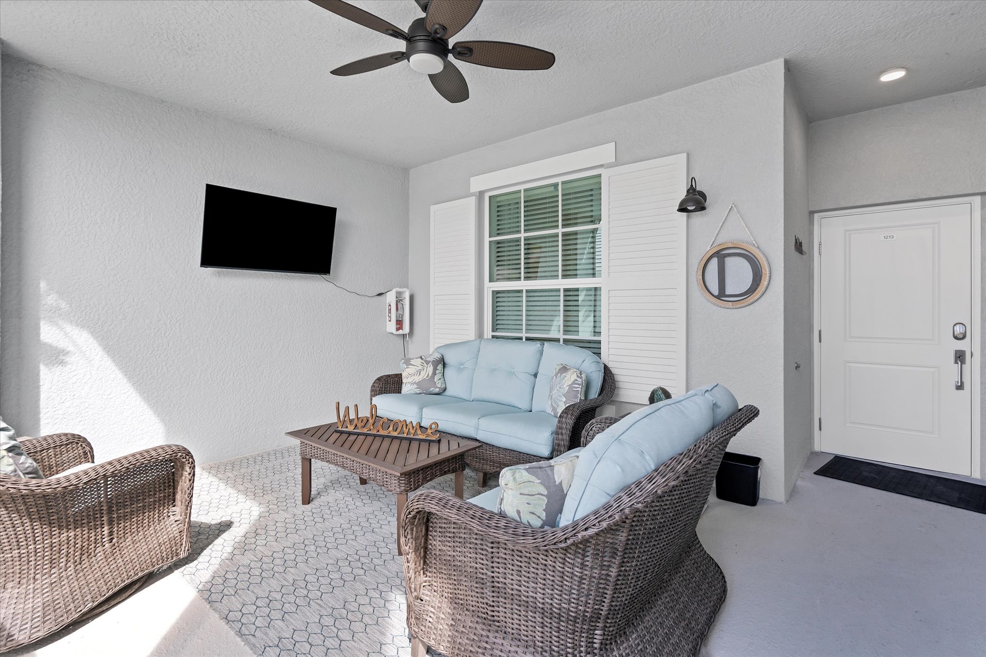 Front lanai features ample seating and a 50-inch Smart TV. Great for entertaining