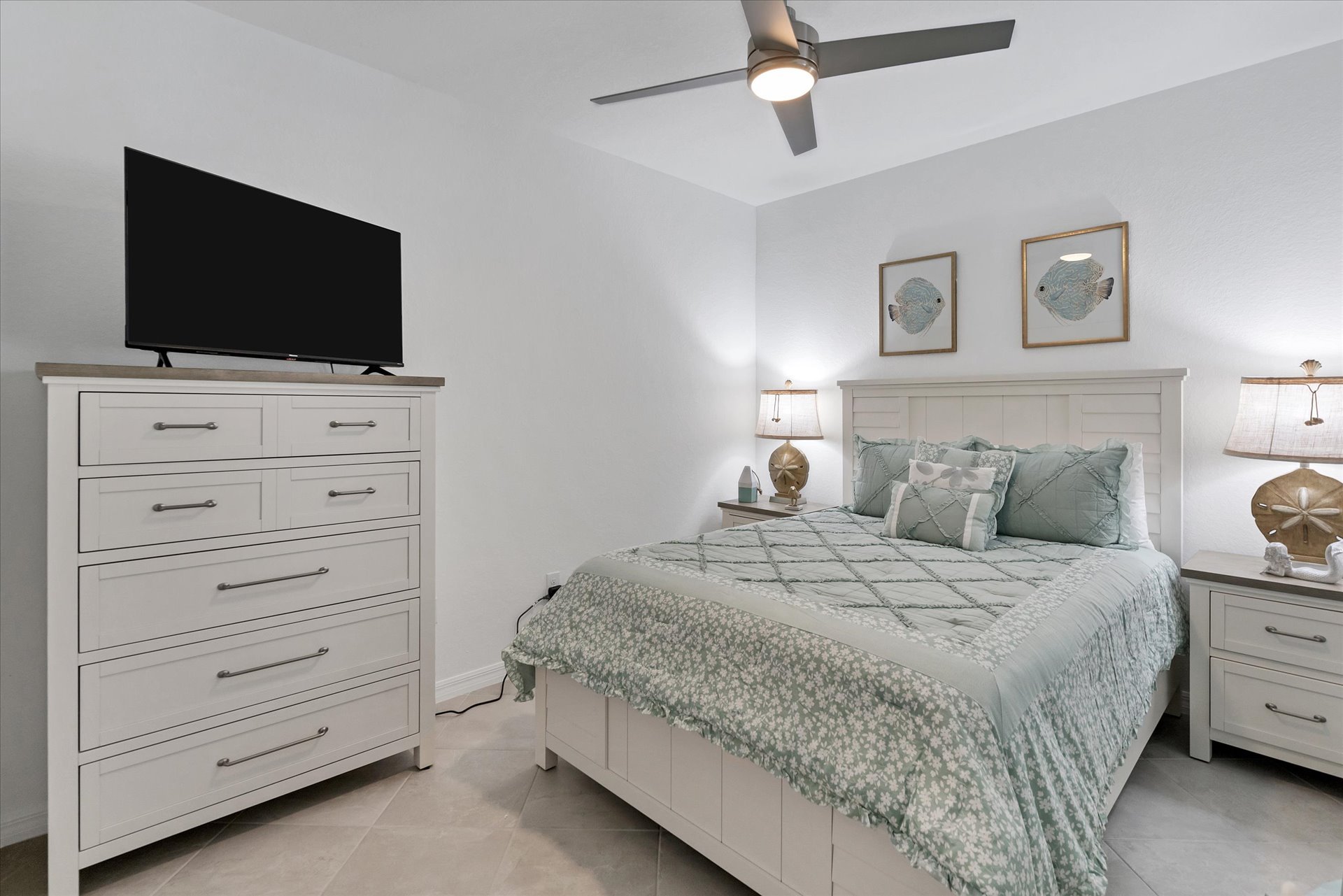 Guest bedroom with one queen bed and 45-inch Smart TV