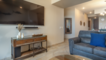 A large screen  is TV available in the living room.