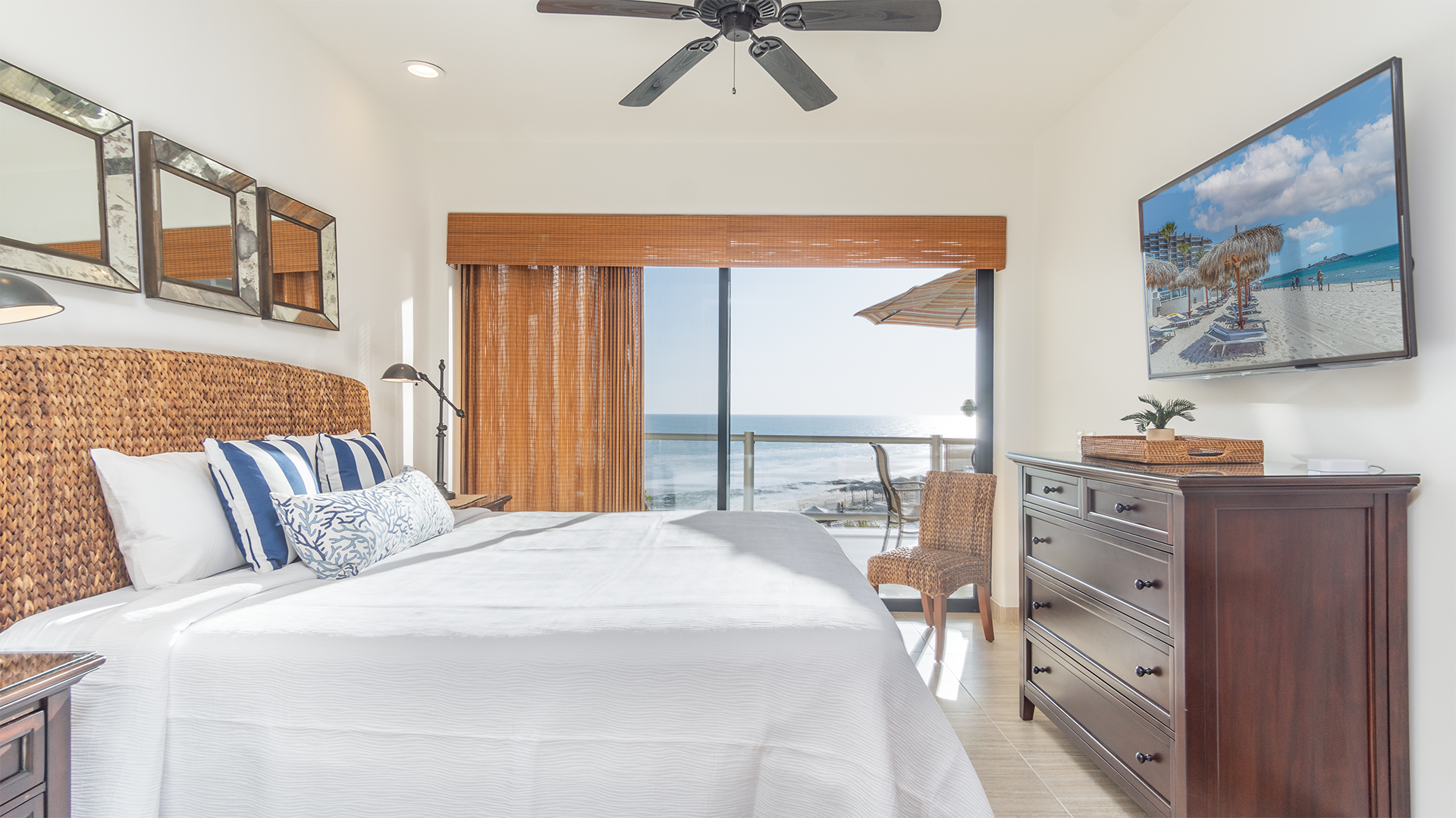 Seaside bedroom with TV and balcony access