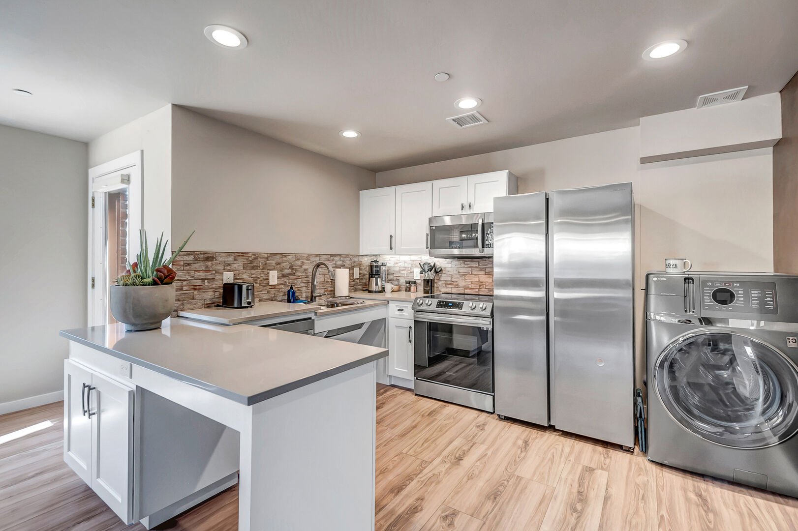 Fully remodeled and equipped kitchen with stainless steel appliances