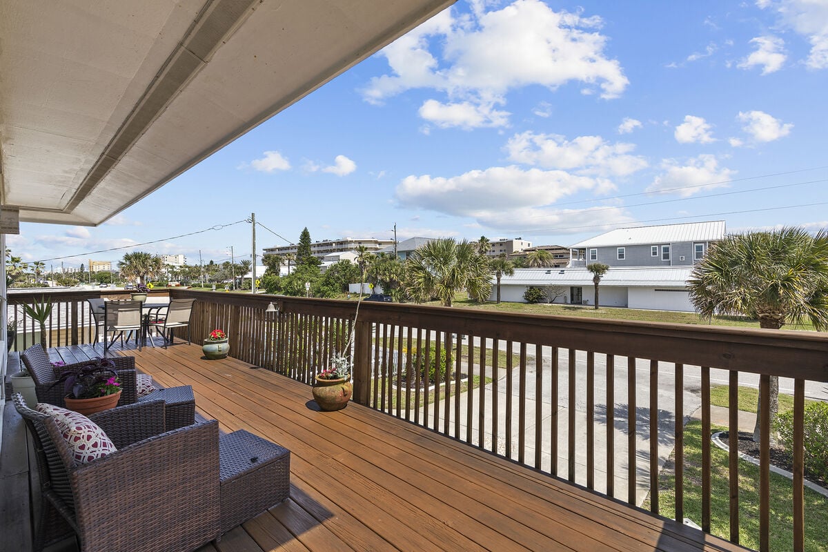 Sunrise Spectacle: Greet the day with open arms from our charming wrap-around balcony. With ample seating and a view that steals the show, it's the perfect extension of your morning routine right off the kitchen.