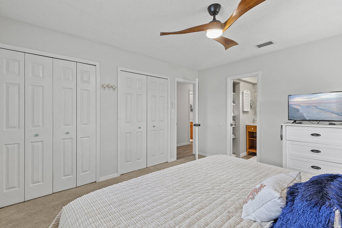 Surrender to serenity in our primary bedroom sanctuary, complete with a plush king bed and ample closet space for your convenience. Refresh and rejuvenate in the luxurious ensuite bathroom, providing a private retreat after a day of beach fun.