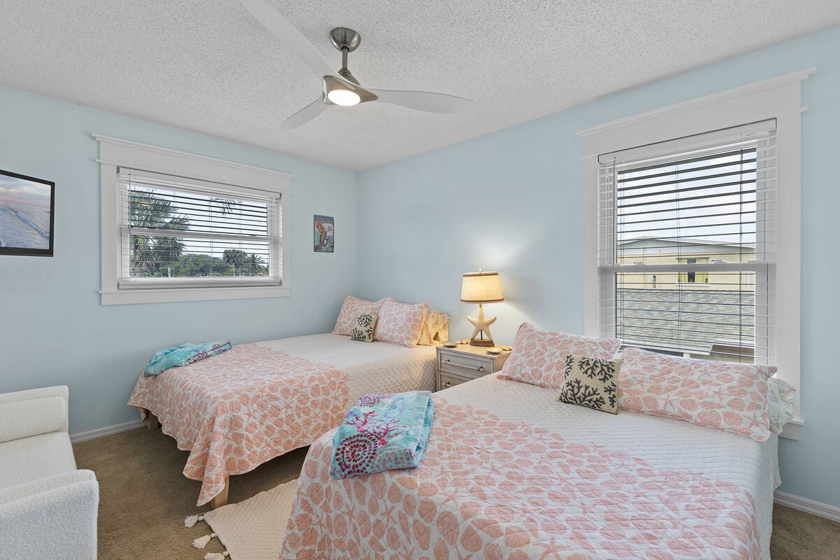 Rest easy in this versatile bedroom offering both a queen and full bed. Unwind with entertainment on the TV, lounge on the sitting bench, and stow your belongings in the closet - all in one cozy space.