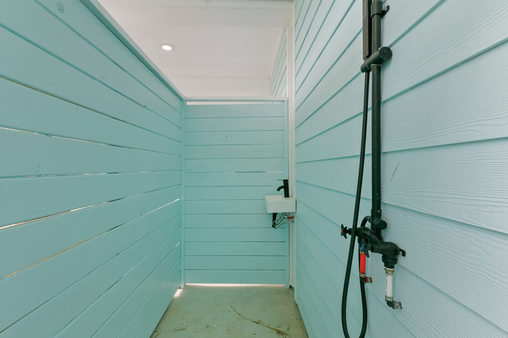 IF YOU'VE TAKEN THE SHORT WALK TO THE BEACH, AN OUTDOOR SHOWER IS LOCATED DOWNSTAIRS