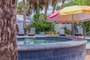Hot Tub and Lounge Chairs - Pool area is a shared space.  Propane Grill by Pool