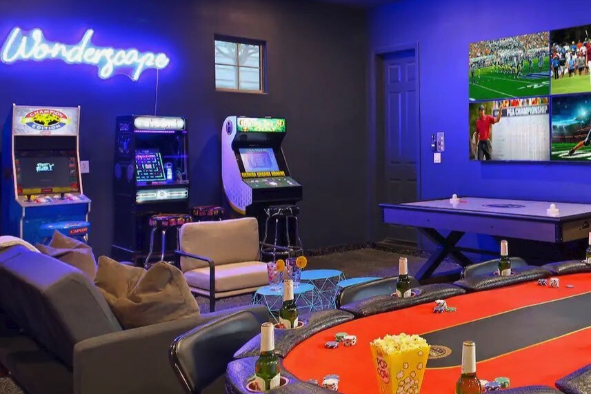 Game room with poker table, arcades and 4 tvs, air hockey