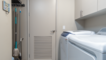 there is a utility room with a washer and dryer