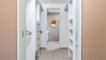 pass through the large walk in closet to access the main bathroom