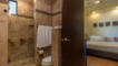 together, the bedroom and bathroom Forna private in-suite