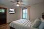 This bedroom is located on the basement level and is called the Moonshine Room! It has a queen bed.