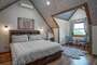 This bedroom is located upstairs. This room is called the Widowmaker! It has a king bed and a private bathroom.