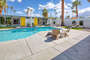 Spacious pool with multiple seating and lounging options available for your enjoyment