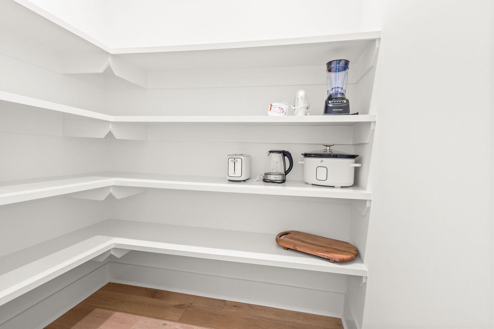 Kitchen feature a large walk-in pantry.