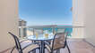 Dining table for four on the balcony.