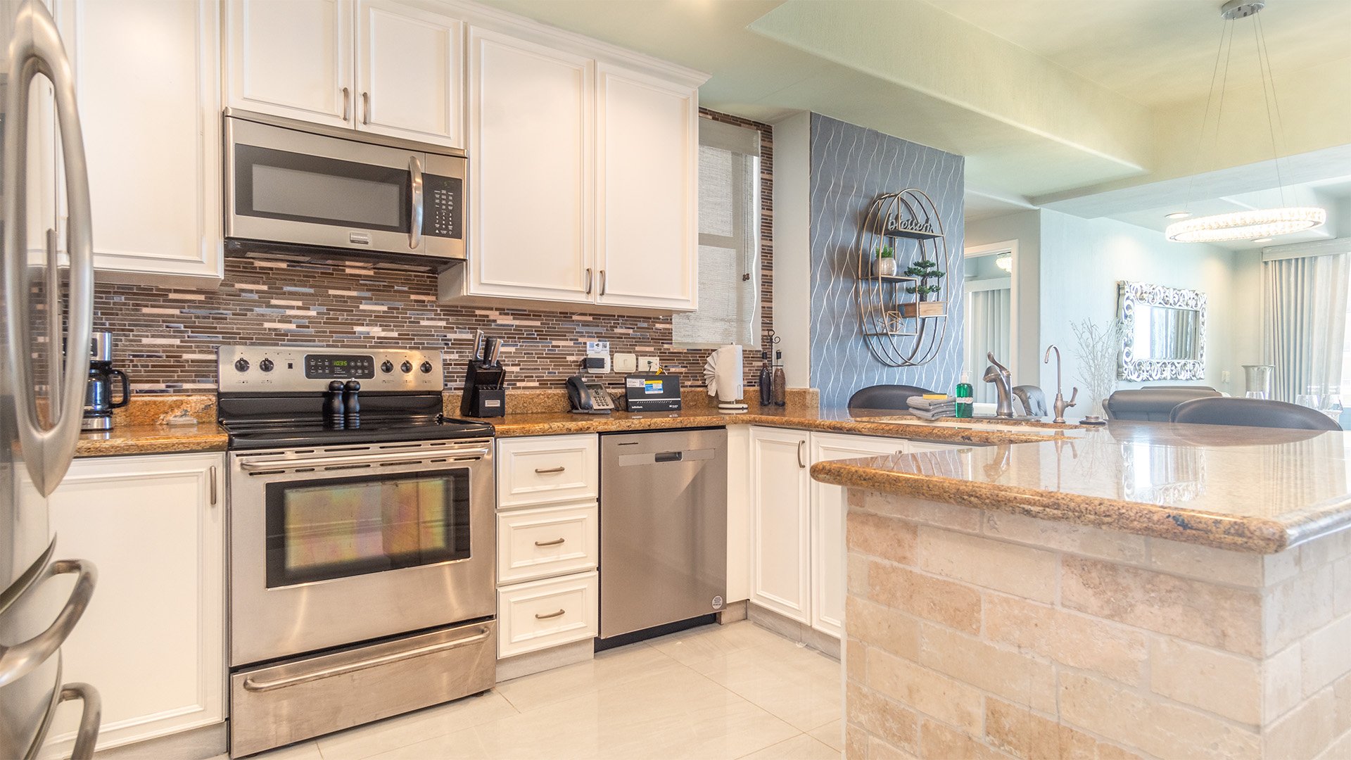 The kitchen is large with full appliances and cookware.