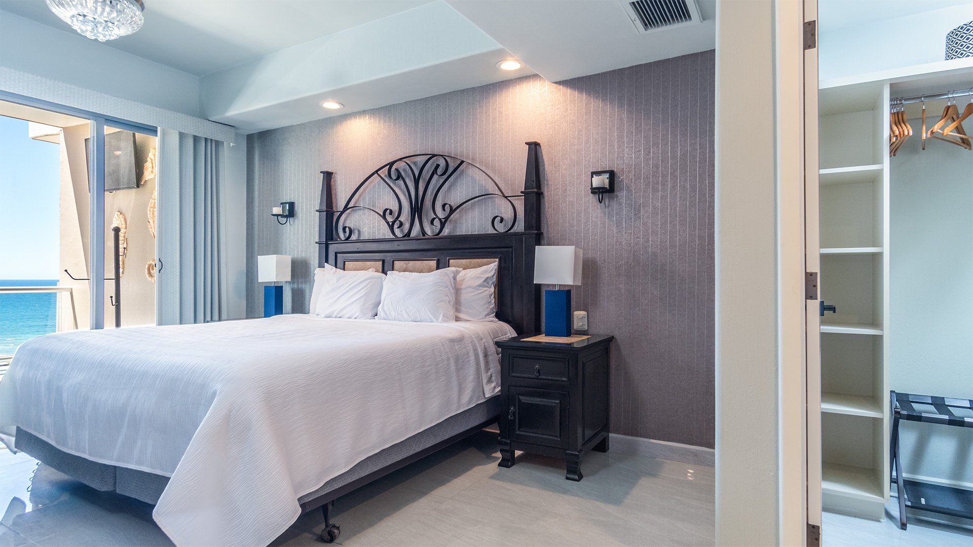 The master bedroom has a walk-in closet and balcony access as well.